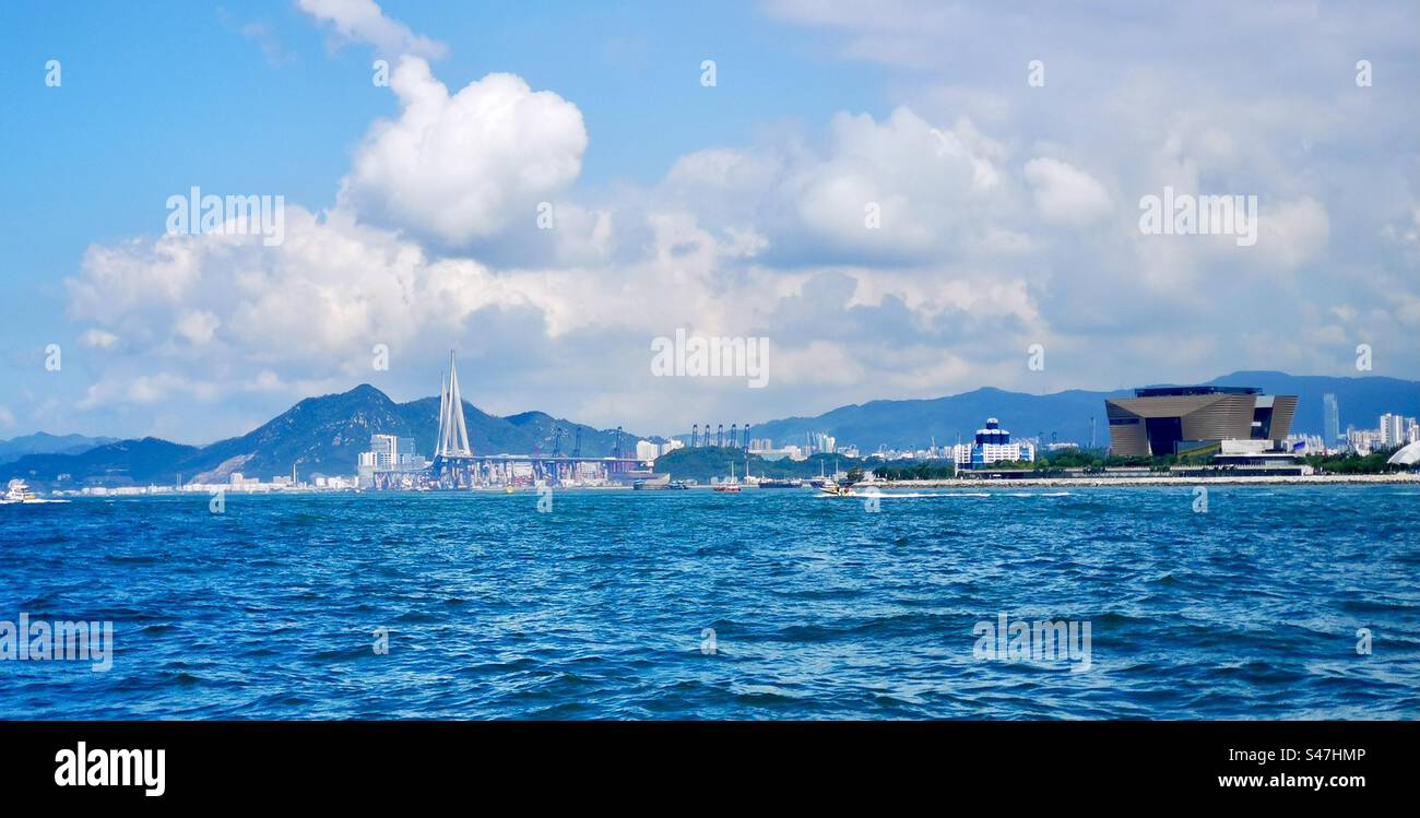 A view of the Western Kowloon cultural district and the stonecutter bridge in Hong Kong. - Smartphone Captured Stock Image