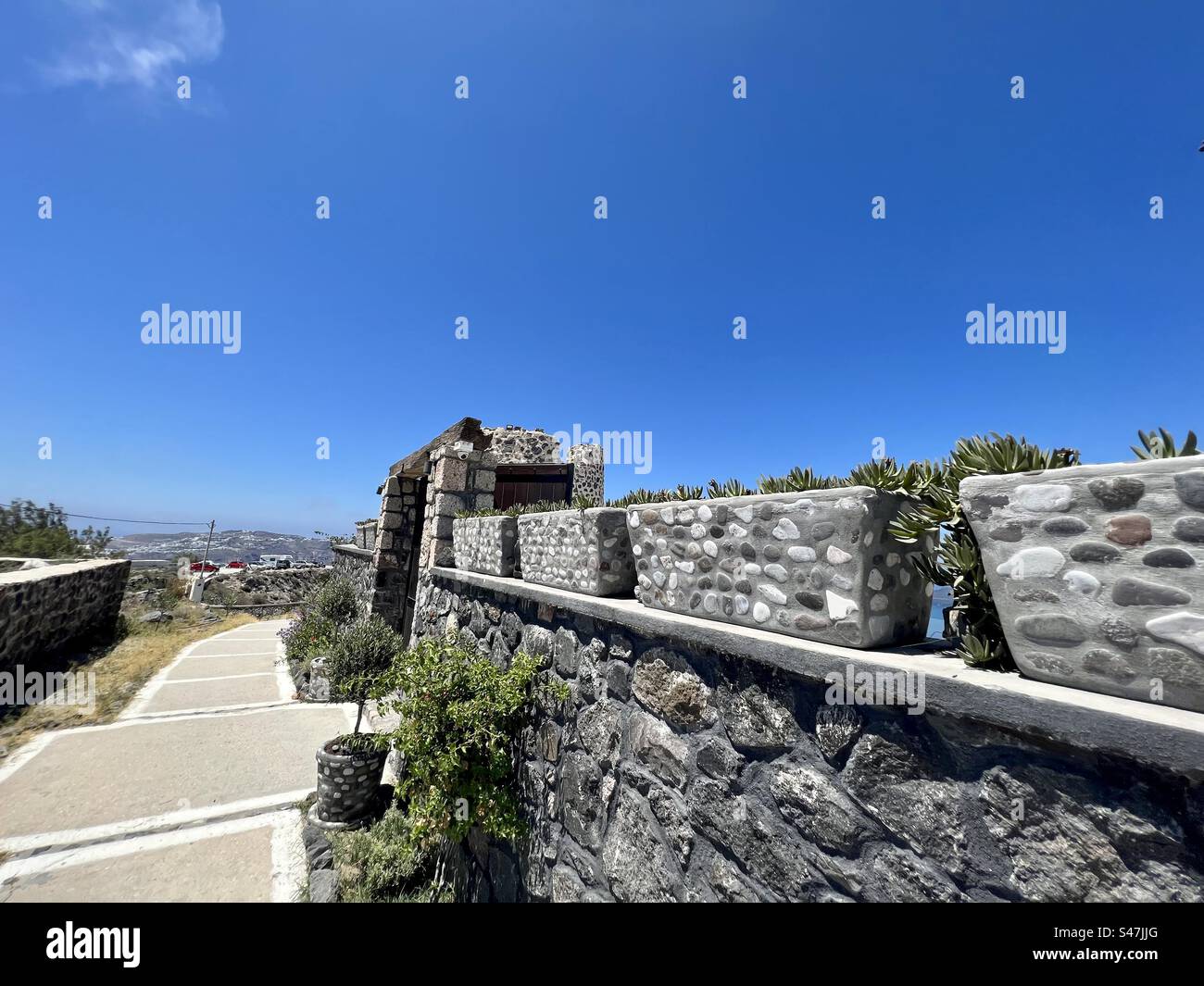Path on cliff tops of Megalochori, Santorini island - Smartphone Captured Stock Image