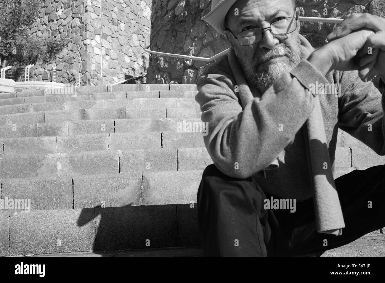 Depressed senior man on staircases Stock Photo