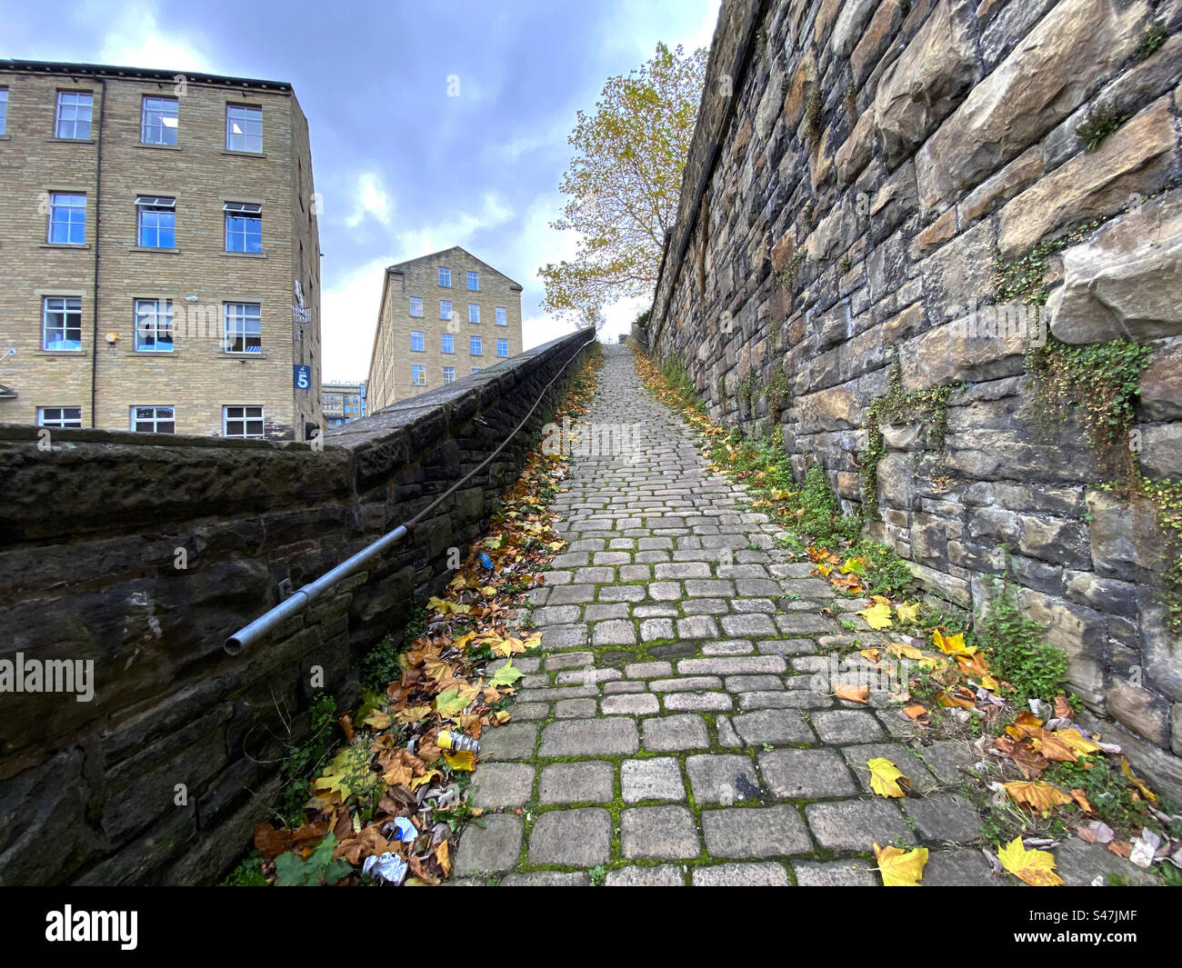 Victorian stone cobbled pathway, built for the mill workers, and ...