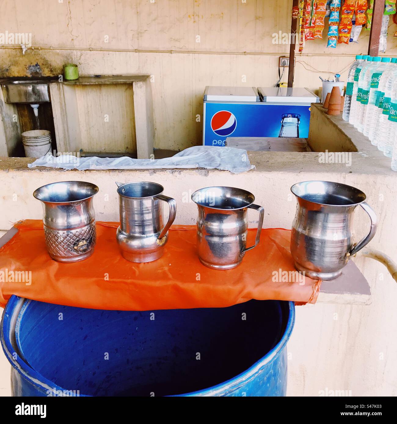 Water jugs and mineral water bottles at a highway eatery in India Stock
