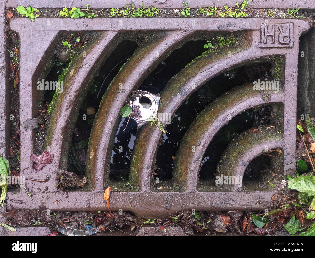 Tin can wedged in drain - Smartphone Captured Stock Image