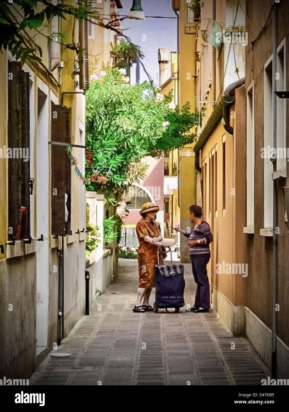 Chatting in the Street - Smartphone Captured Stock Image
