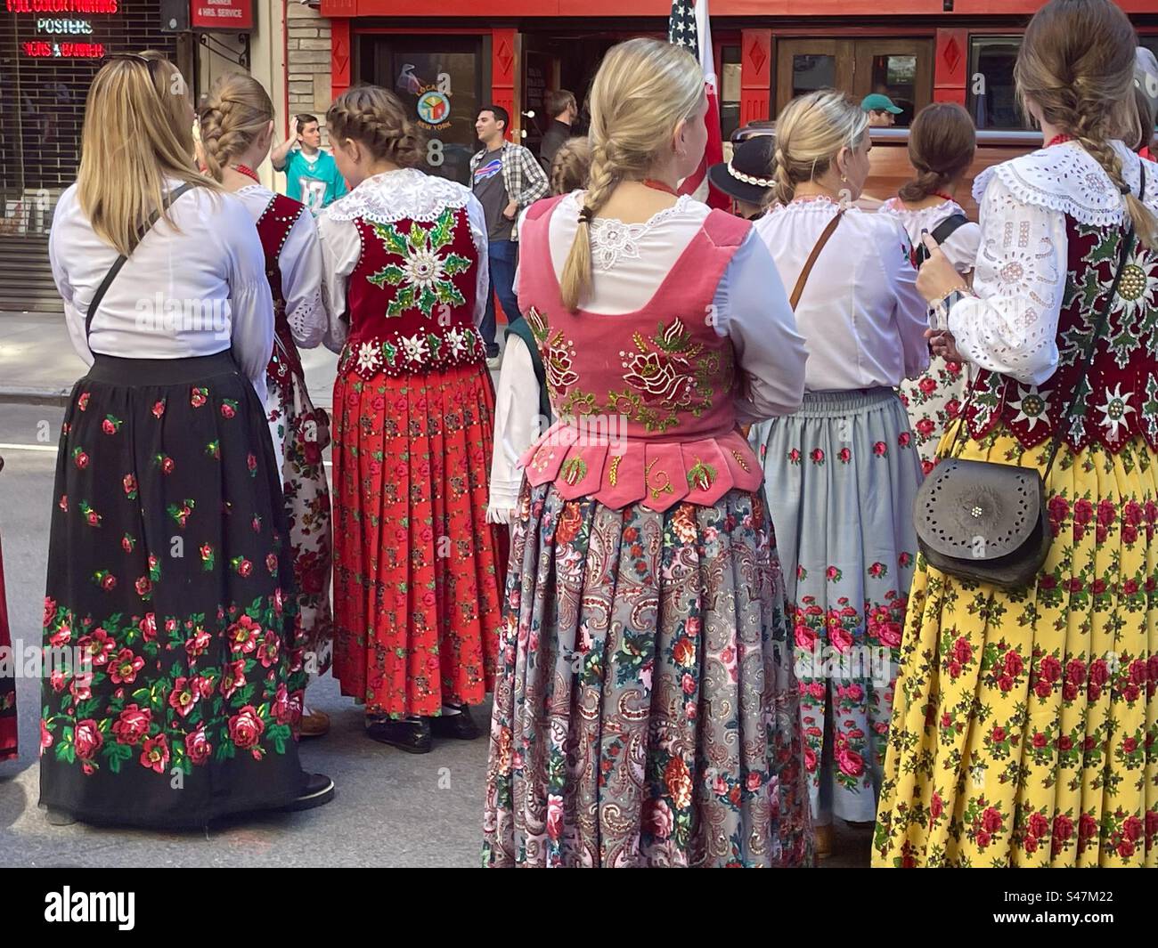 Women in Polish costumes waiting at Polish Day Parade in New York City. Stock Photo