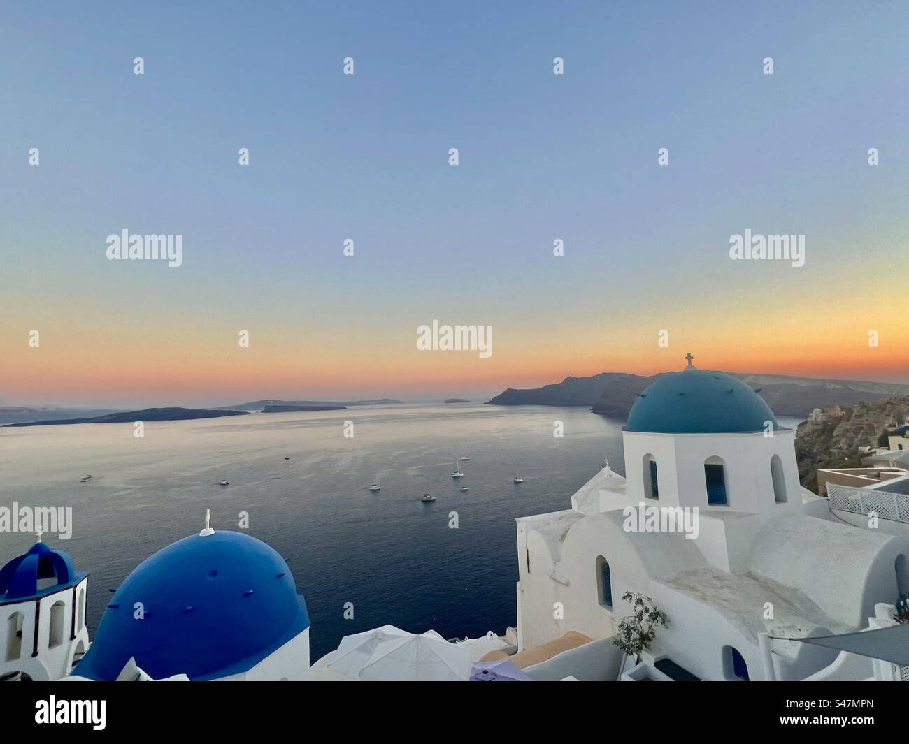 Orange horizon of Sunset in the Santorini caldera. - Smartphone Captured Stock Image
