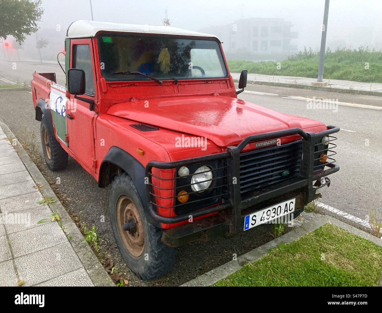 Old red Land Rover Santana cut down to make a pick up - Smartphone Captured Stock Image