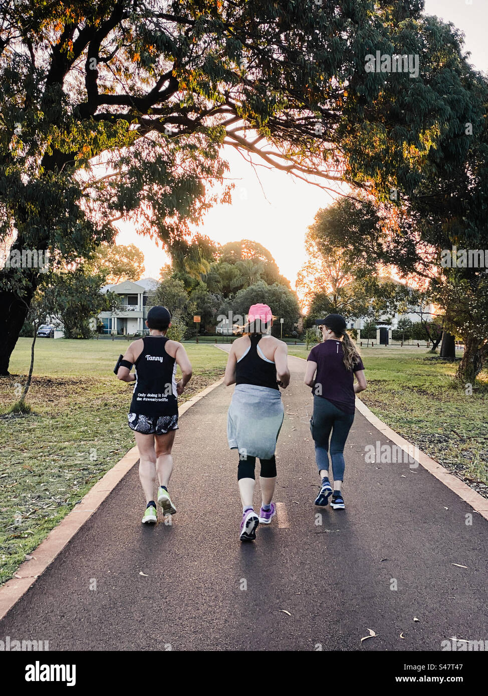 Fitness freaks during evening run at Lake Monger in Western Australia. - Smartphone Captured Stock Image