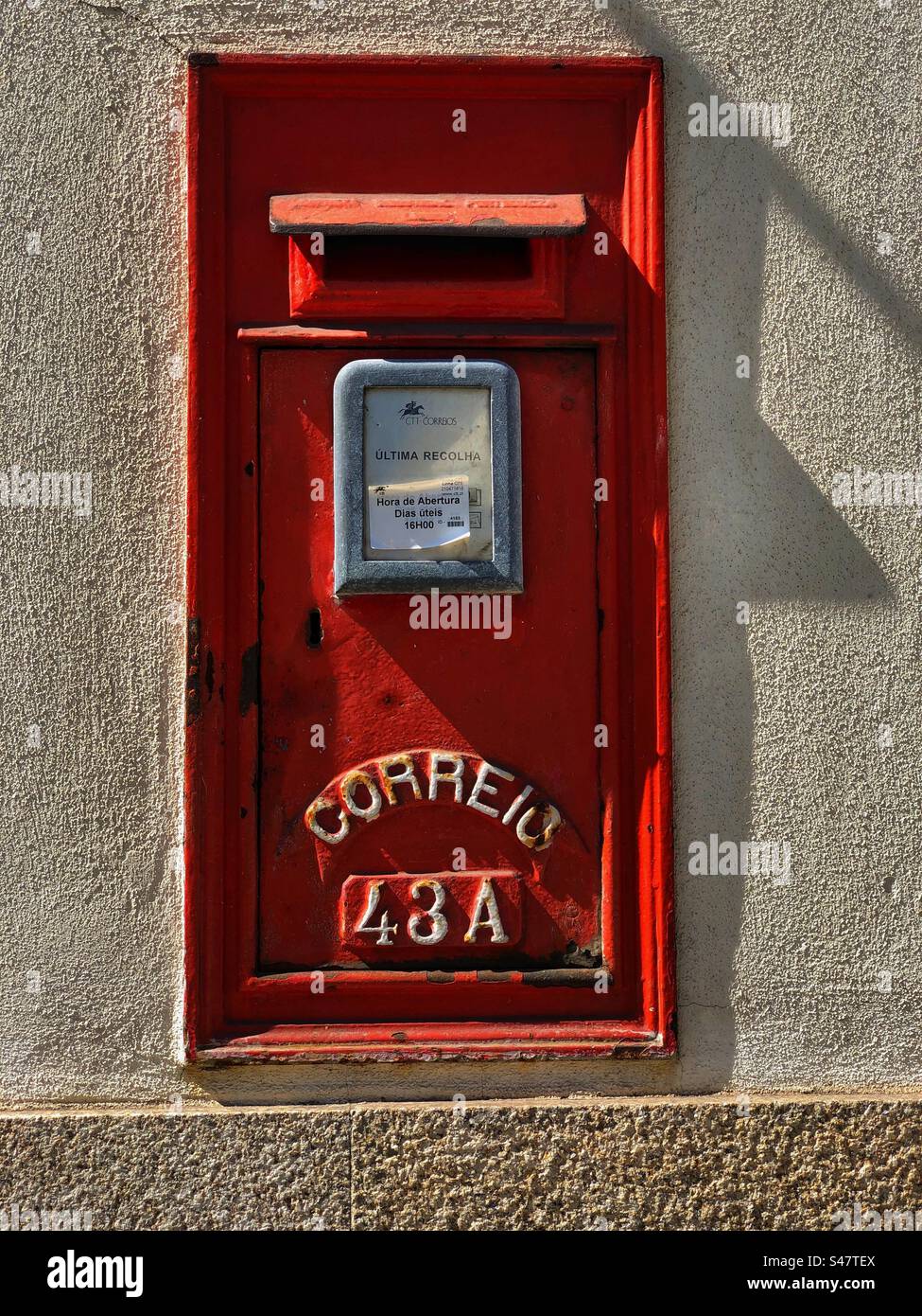 Red mailbox reading in Portuguese CORREIO 43 A, Porto, Portugal, 2022 - Smartphone Captured Stock Image