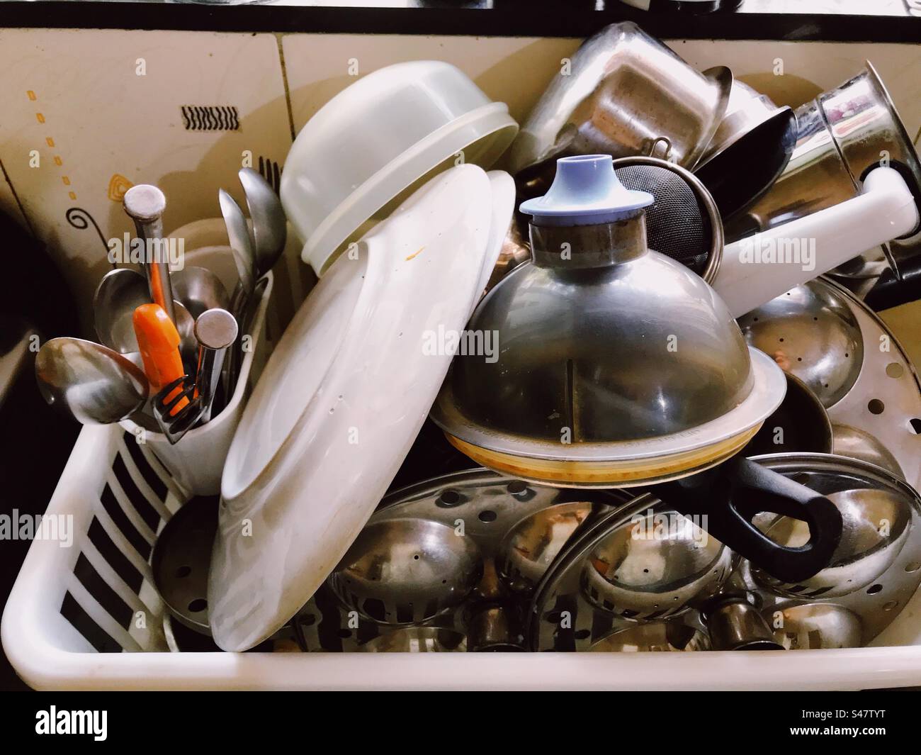 Kitchen utensils and cutlery kept to dry after washing Stock Photo Alamy