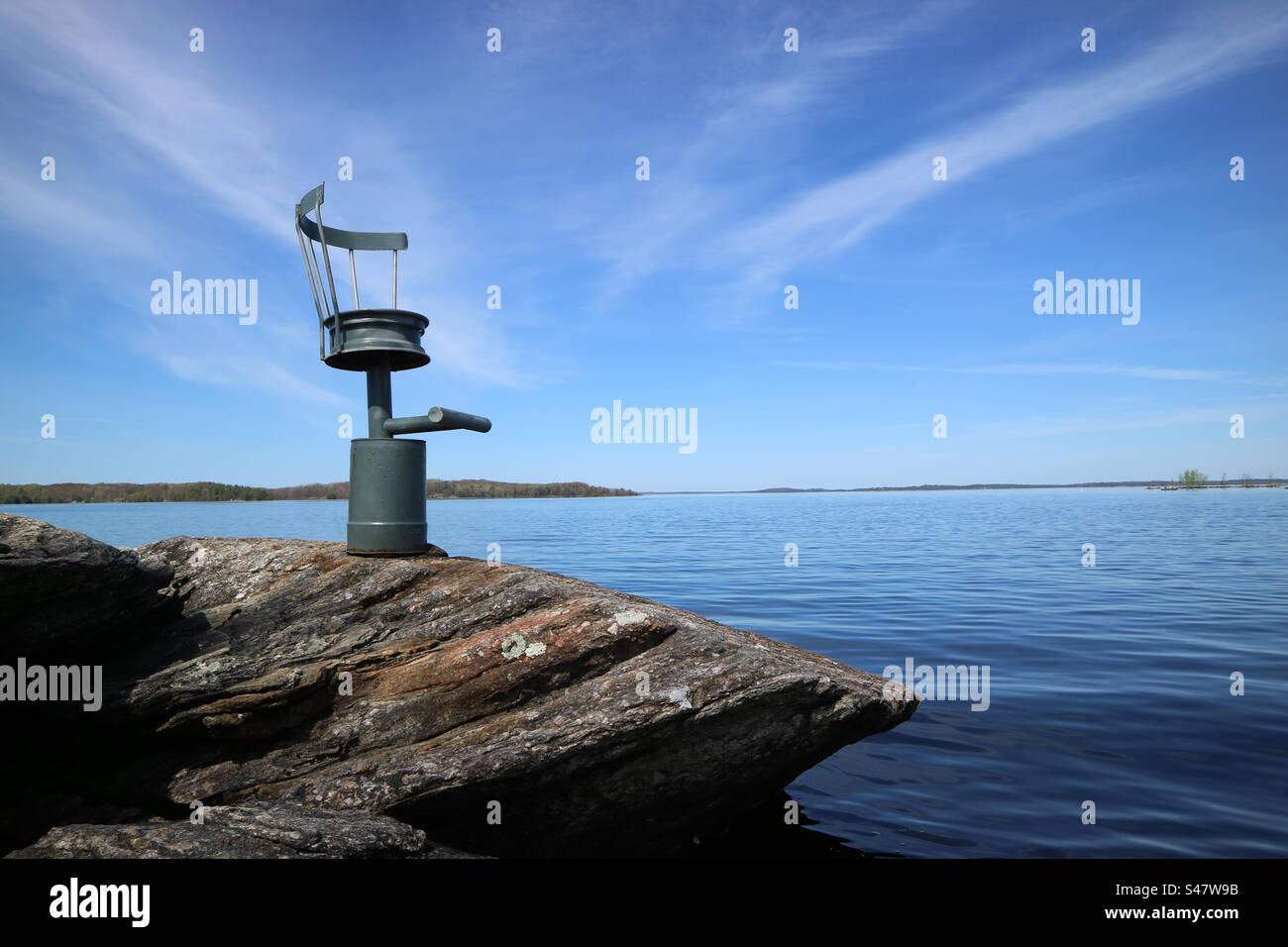 Chair built into rock over looking Georgian Bay, Parry Sound Ontario. Stock Photo