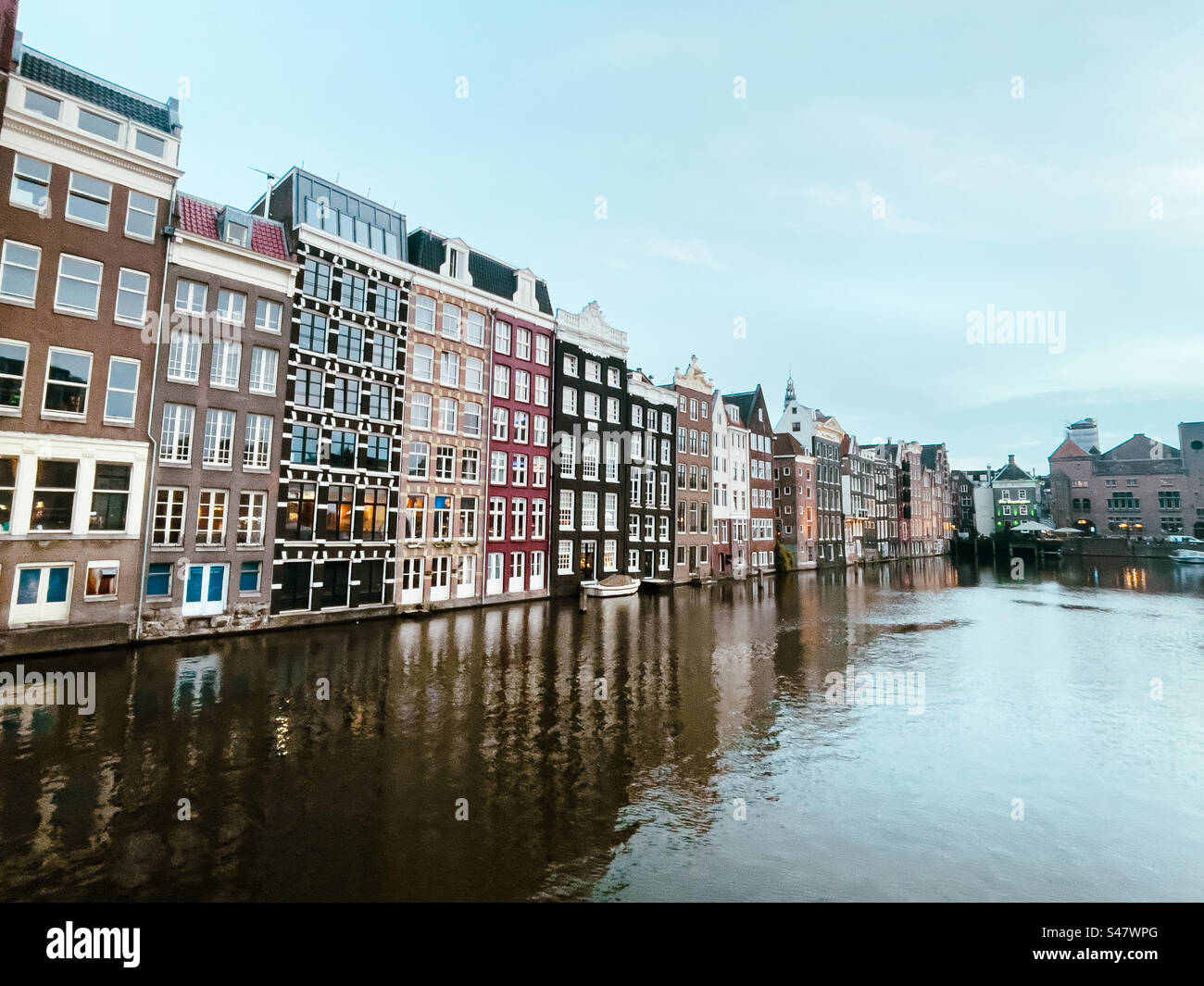 Buildings on canal in Amsterdam on an October evening. - Smartphone Captured Stock Image