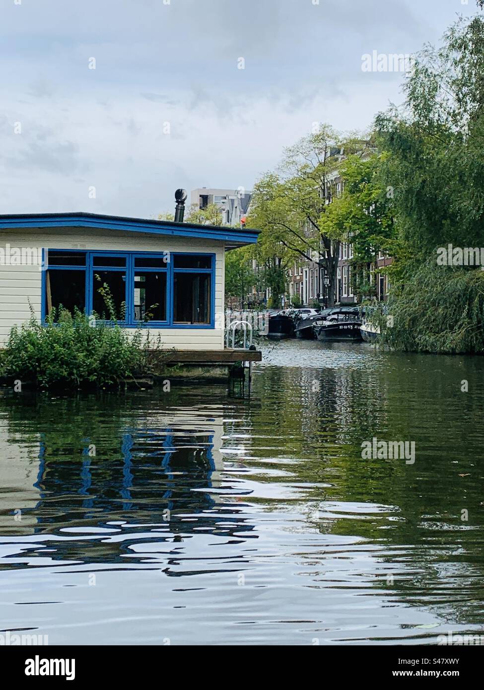 Canal home Amsterdam Netherlands Stock Photo
