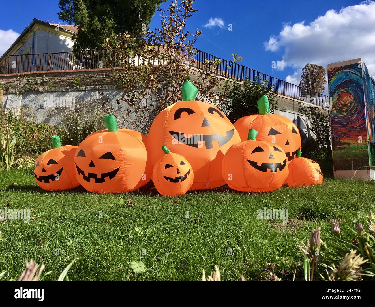 Inflatable pumpkin balloons in public garden - Smartphone Captured Stock Image
