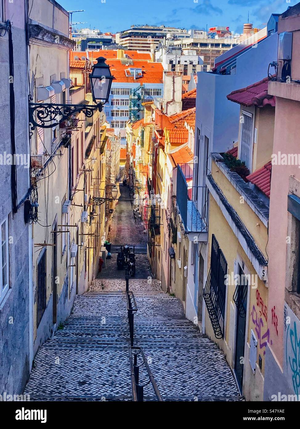 Looking down a Steep stepped street in Lisbon Portugal Stock Photo - Alamy