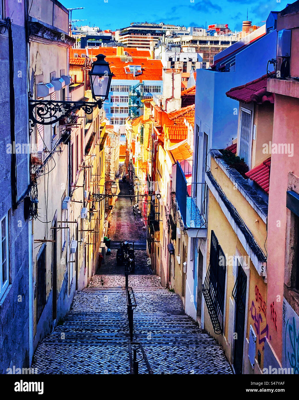 Looking down a Steep stepped street in Lisbon Portugal Stock Photo - Alamy