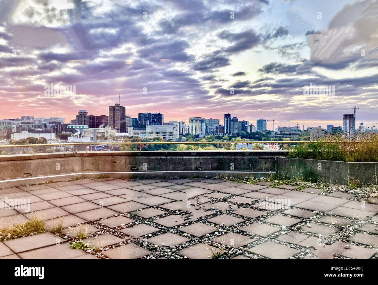 Dawn over the city of Ottawa skyline on a partly cloudy day. - Smartphone Captured Stock Image