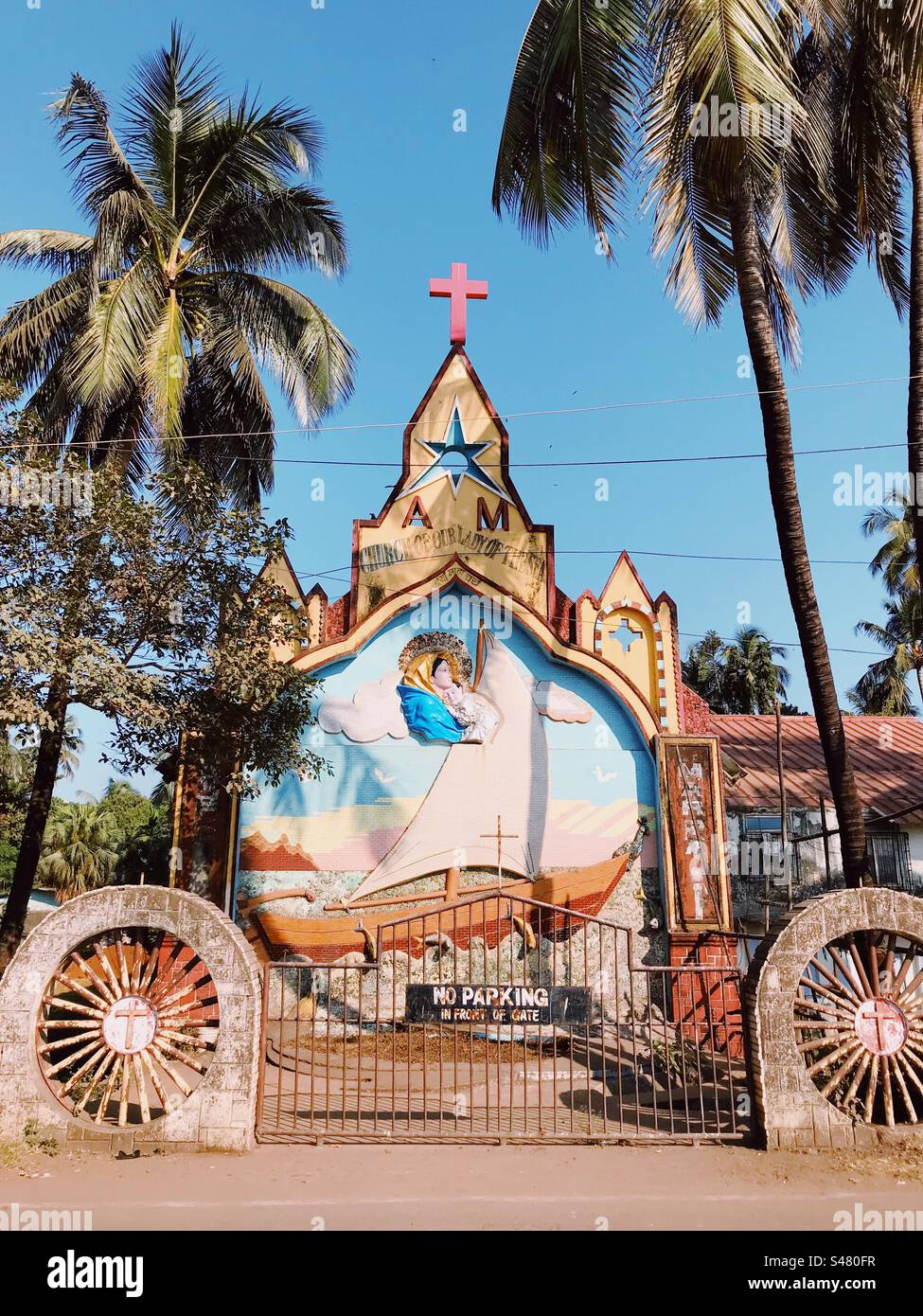 A church in Madh Island in Mumbai India with a No Parking sign outside it - Smartphone Captured Stock Image