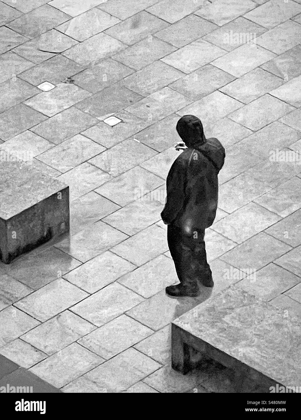 Lone smoker in the rain Stock Photo Alamy