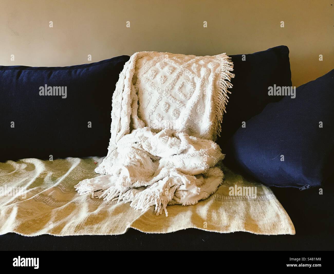 Bed sheets and a pillow on a couch - Smartphone Captured Stock Image