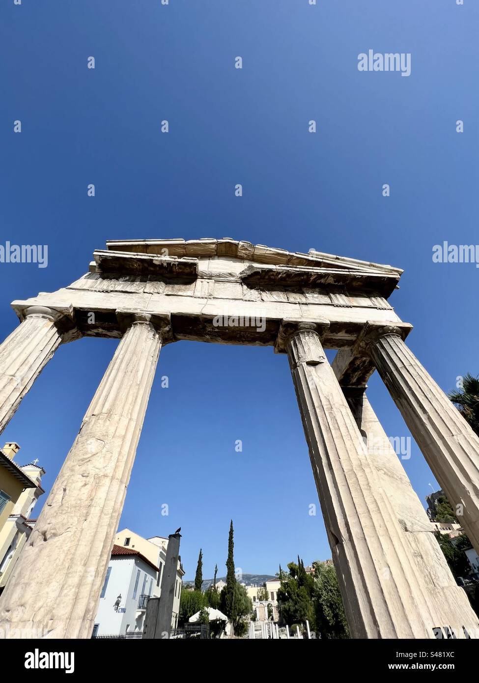 The Gate of Athena Archegetis stands tall at the entrance to the Roman Agora archaelogical in Athens, Greece. - Smartphone Captured Stock Image
