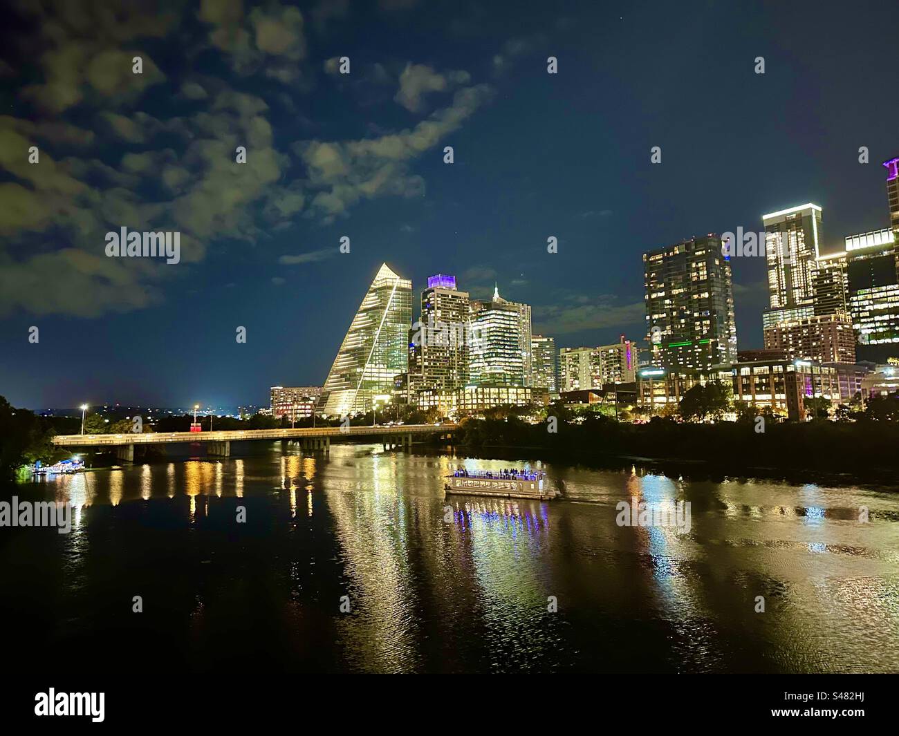 Austin skyline at night with tour boat on Ladybird Lake Stock Photo - Alamy