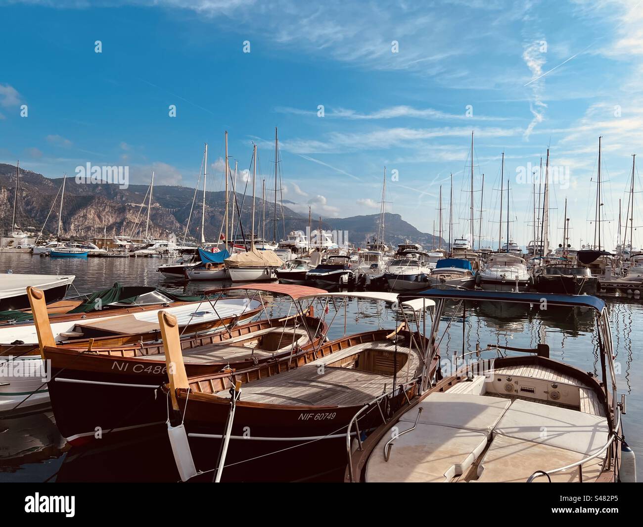 Luxury yachts moored in St-Jean-Cap-Ferrat harbour in late summer, south of France, Nice Stock Photo