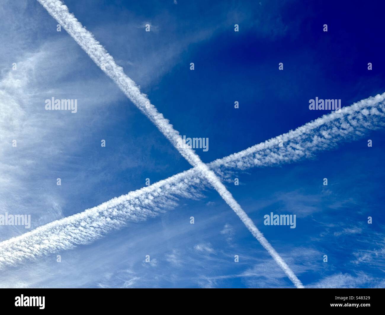 X formerly known as Twitter sky contrails over Austin,Texas - Smartphone Captured Stock Image