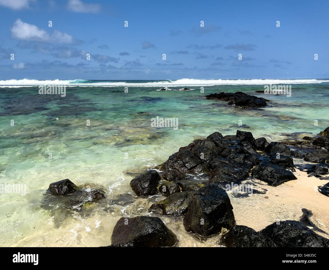 Turquoise ocean water at Riambel beach, Mauritius, East Africa - Smartphone Captured Stock Image