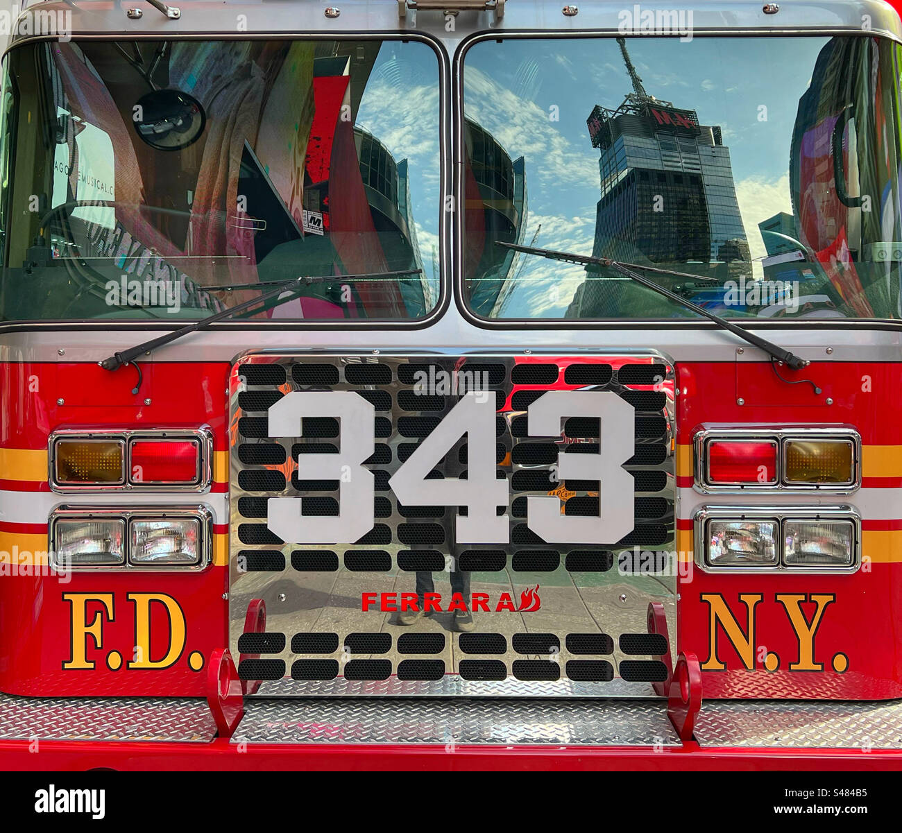 Front of New York City fire truck with reflections of Times Square in windscreen - Smartphone Captured Stock Image
