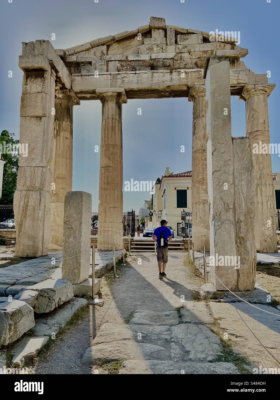 Walking through the Gate of Athena Archegetis, exploring the ancient archaeological site of the Roman Agora in Athens in summer. - Smartphone Captured Stock Image