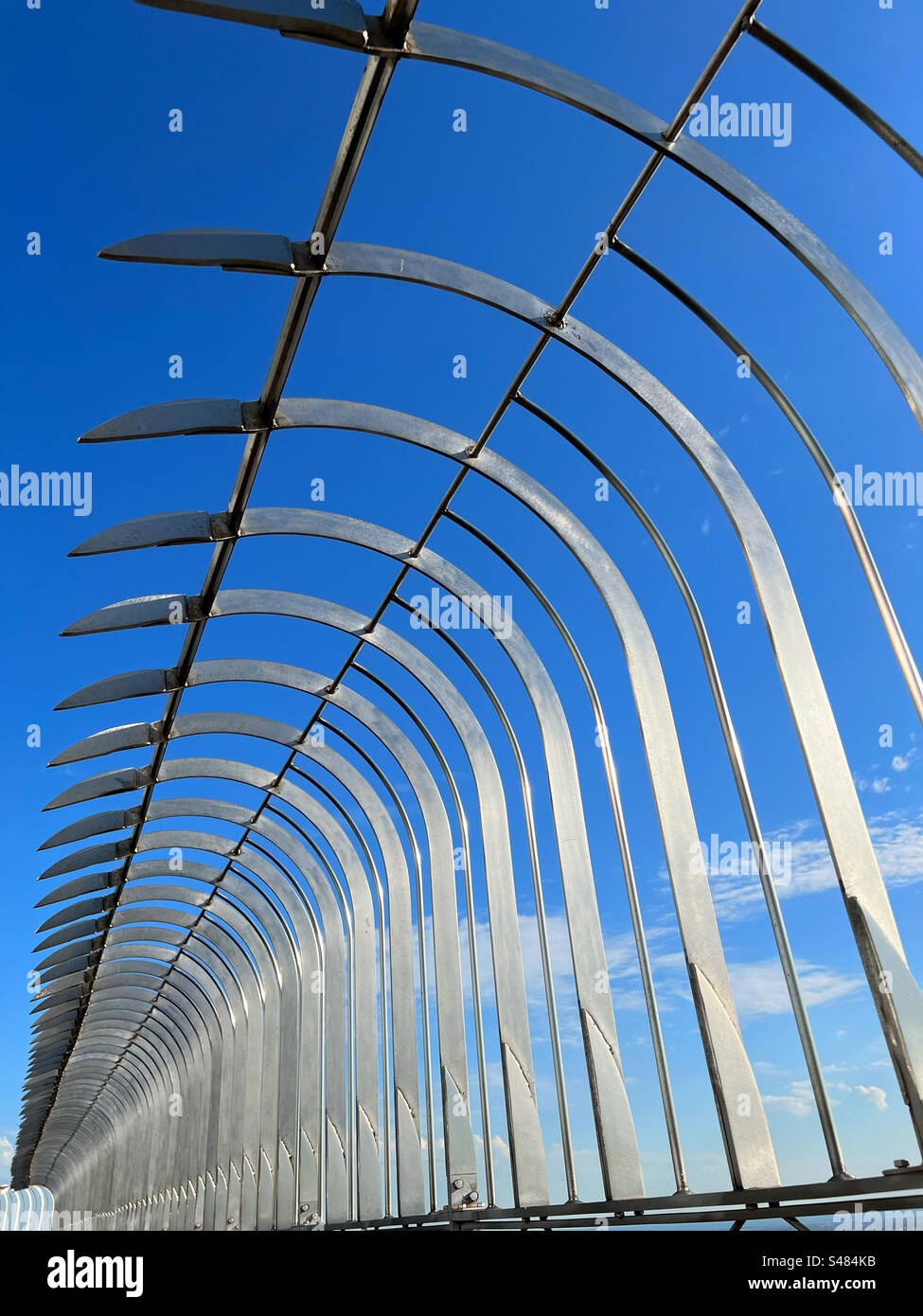 Abstract of safety fencing on Empire State Building against a vivid blue sky Stock Photo