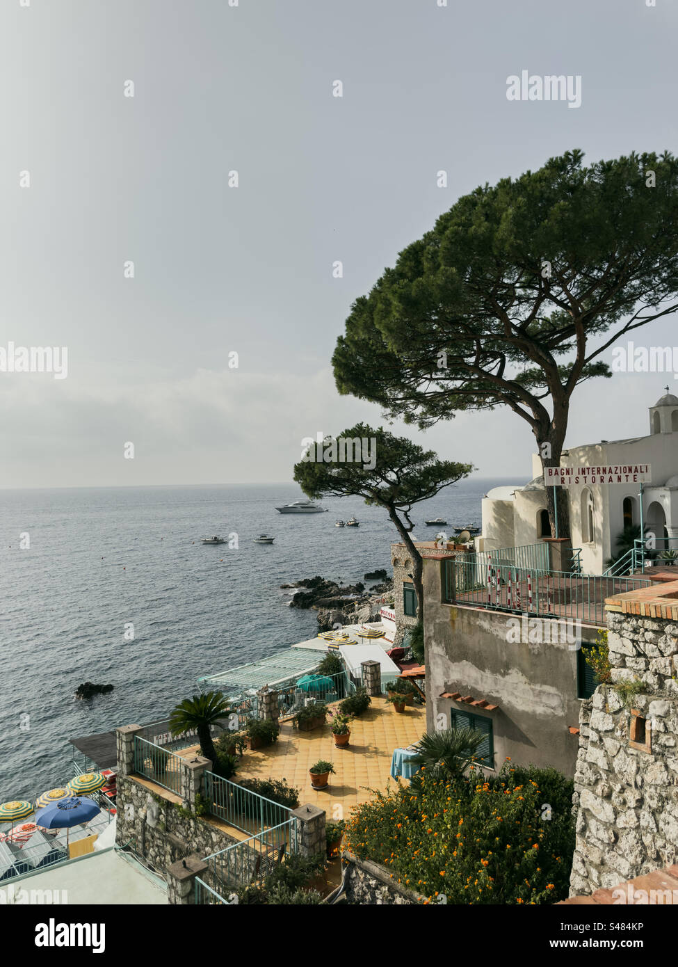 Bustling Beachfront Cafés, Hotels, and Bars Along Marina Piccola, Via Marina Piccola, Capri, Italy - Smartphone Captured Stock Image