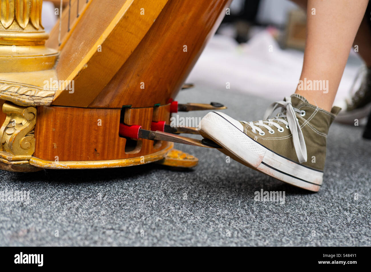 playing the harp in sneakers - Smartphone Captured Stock Image