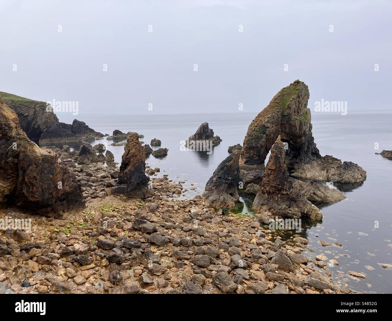 Calm waters at the Crohy Head Sea Arch, County Donegal, Ireland Stock Photo