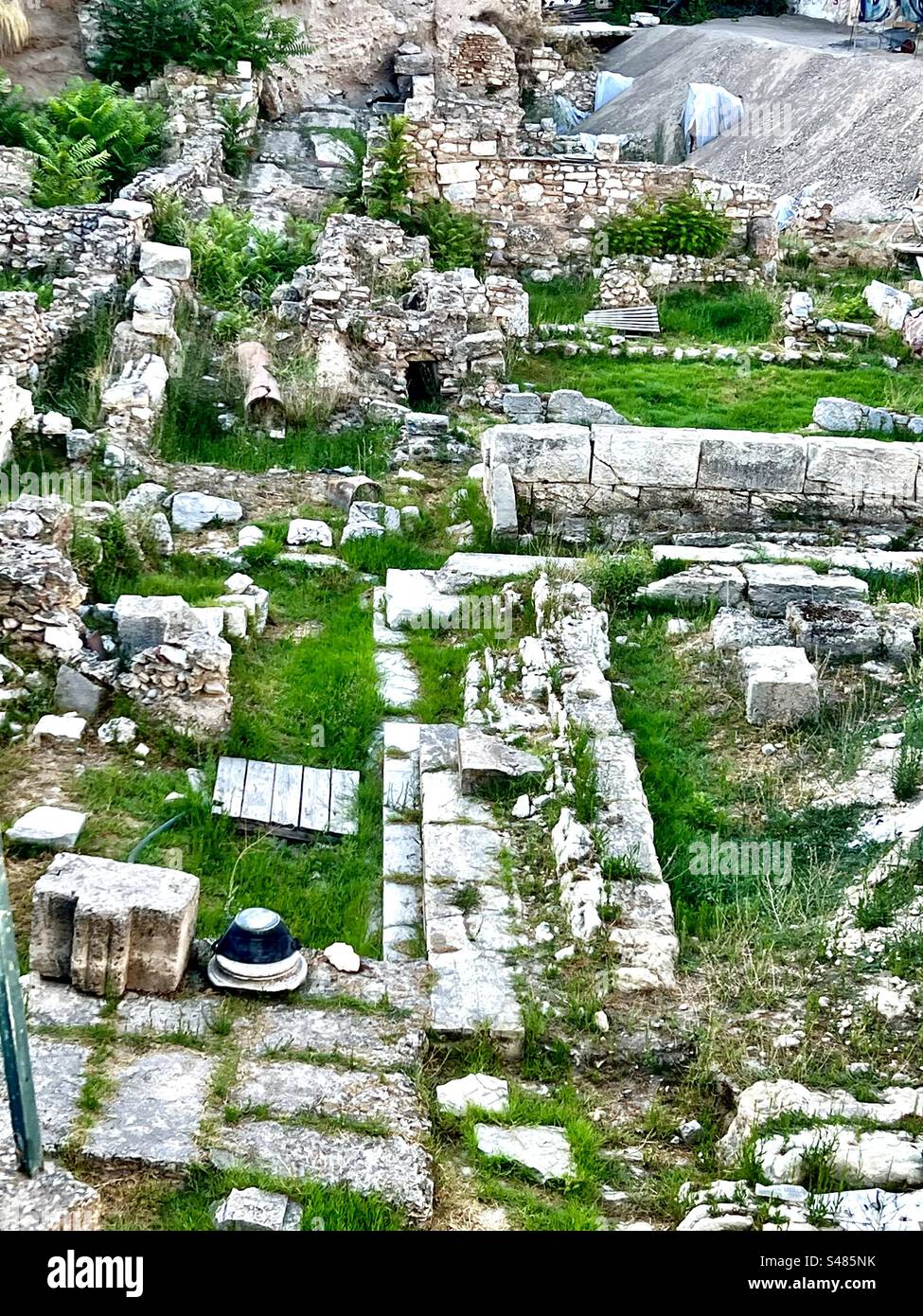 Ruins of the Stoa Basileios, or Royal Stoa, are part of the ancient Athenian Agora in the Monastiraki neighborhood, seen from Adrianoy Street just above them. - Smartphone Captured Stock Image