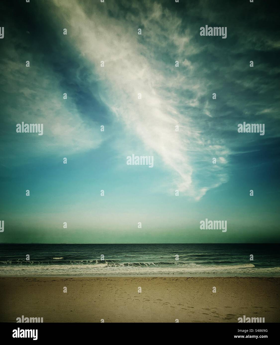Cirrostratus clouds over the beach Stock Photo