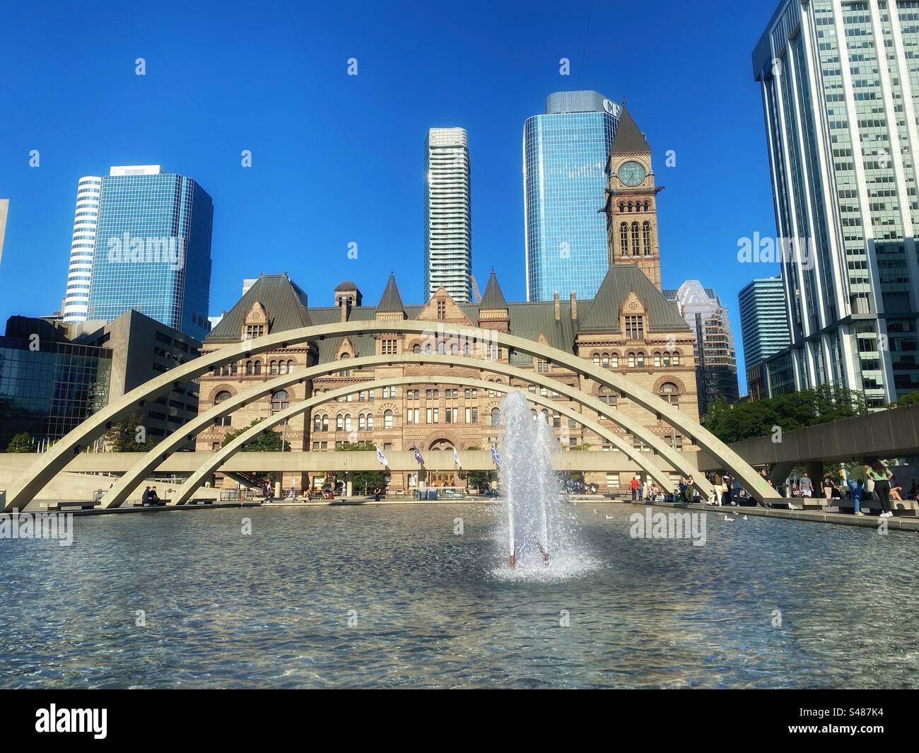 Old Toronto City hall view behind the lake and fountains - Smartphone Captured Stock Image