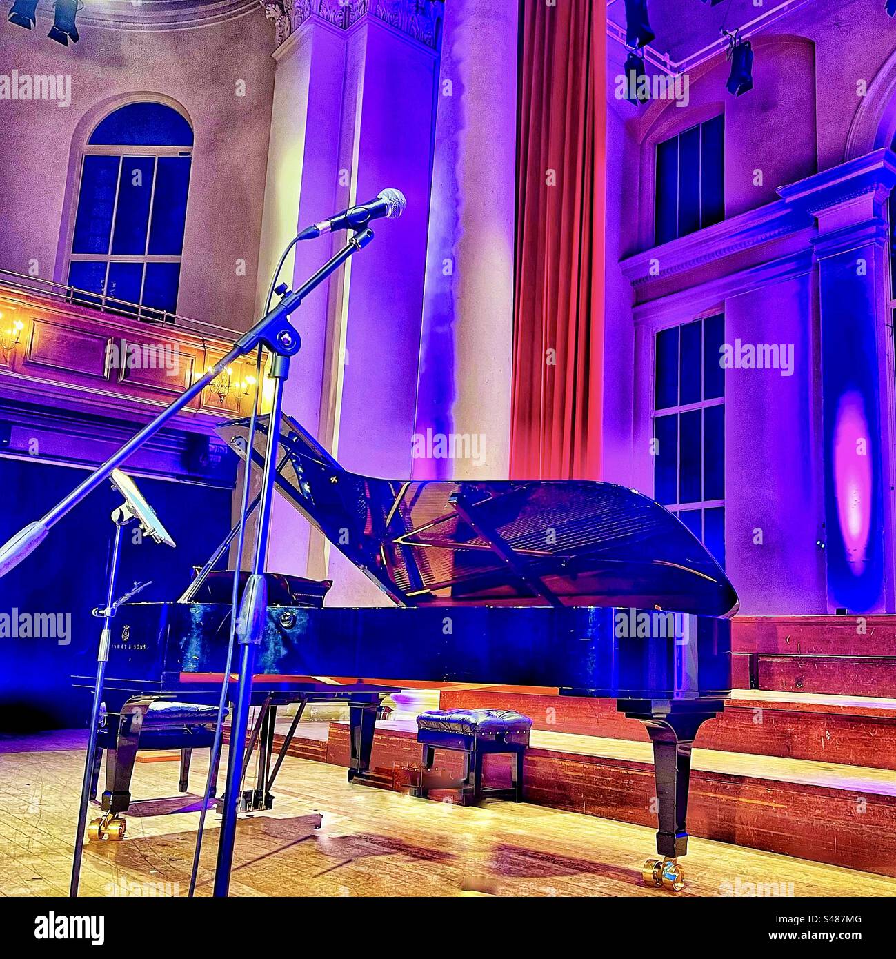Steinway piano in St John’s Church in Smith Square in Westminster, London SW1. The church is used as a concert venue especially classical and contemporary music. - Smartphone Captured Stock Image