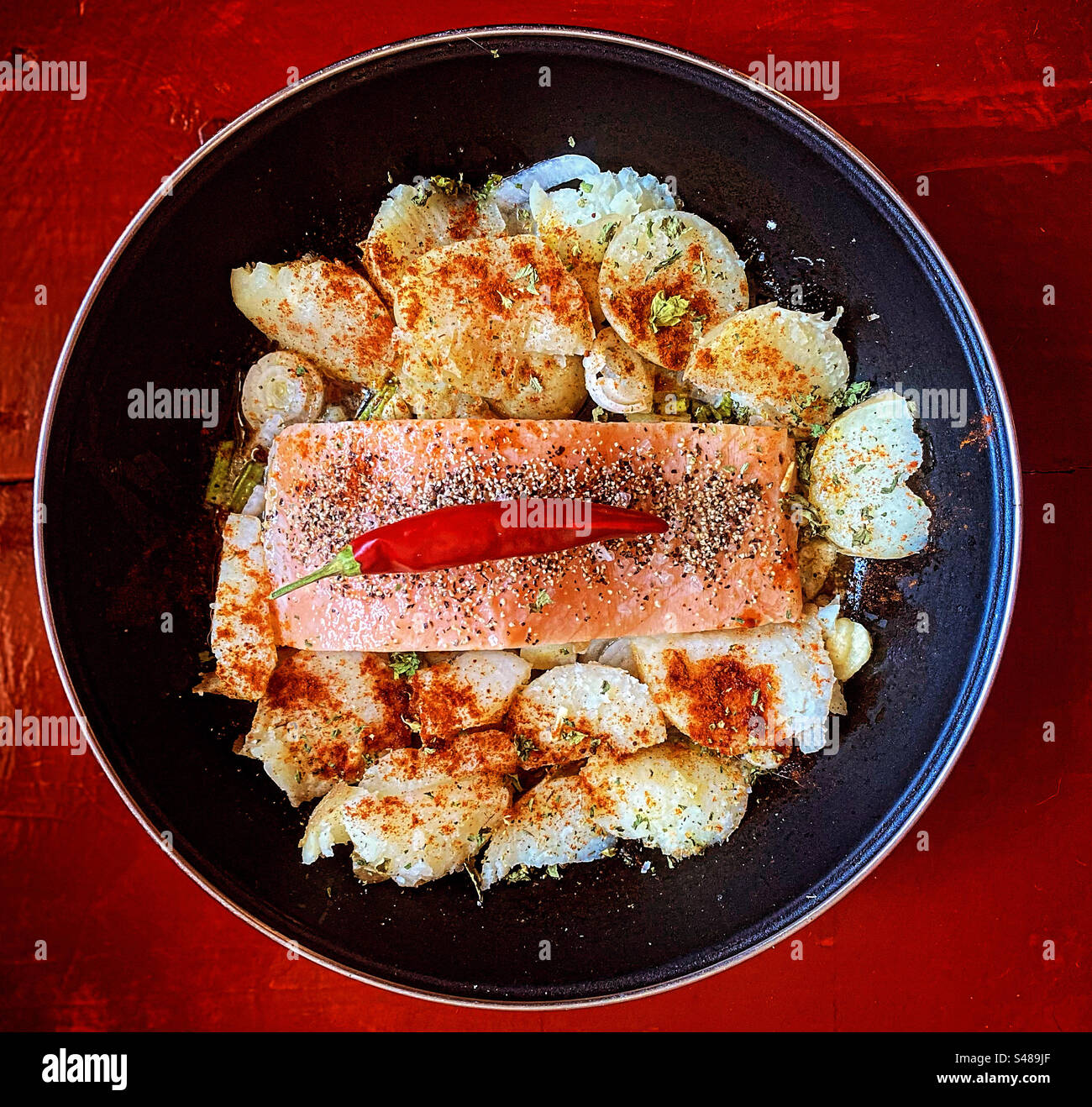 Salmon with potatoes in a pot in Queretaro, Mexico - Smartphone Captured Stock Image