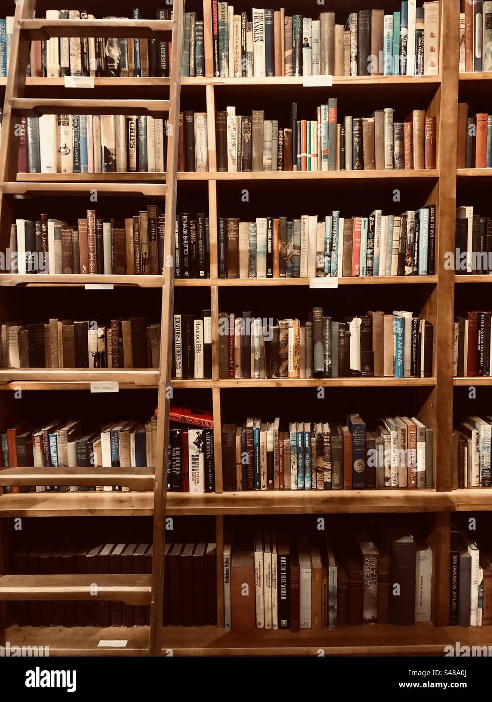 Antigue bookshop with full book shelves and stairs - Smartphone Captured Stock Image