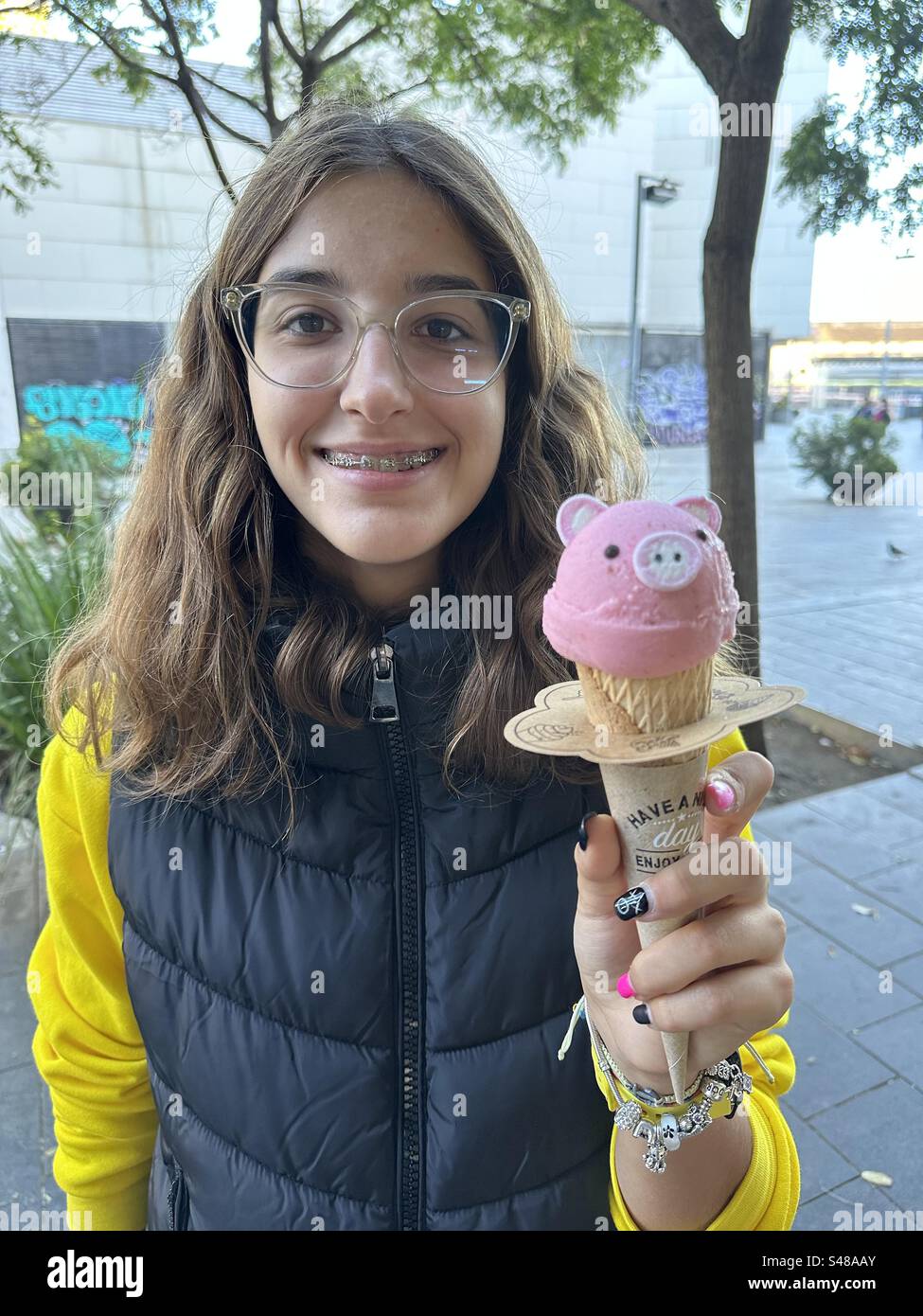 Adolescent girl with Japanese zoo ice cream - Smartphone Captured Stock Image