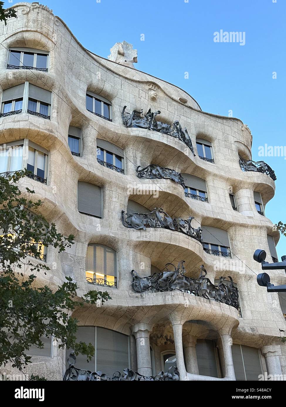 Casa Milà, popularly known as La Pedrera, a Modernista building in Barcelona, Catalonia, Spain, designed by architect Antoni Gaudí and was built between 1906 and 1912 - Smartphone Captured Stock Image