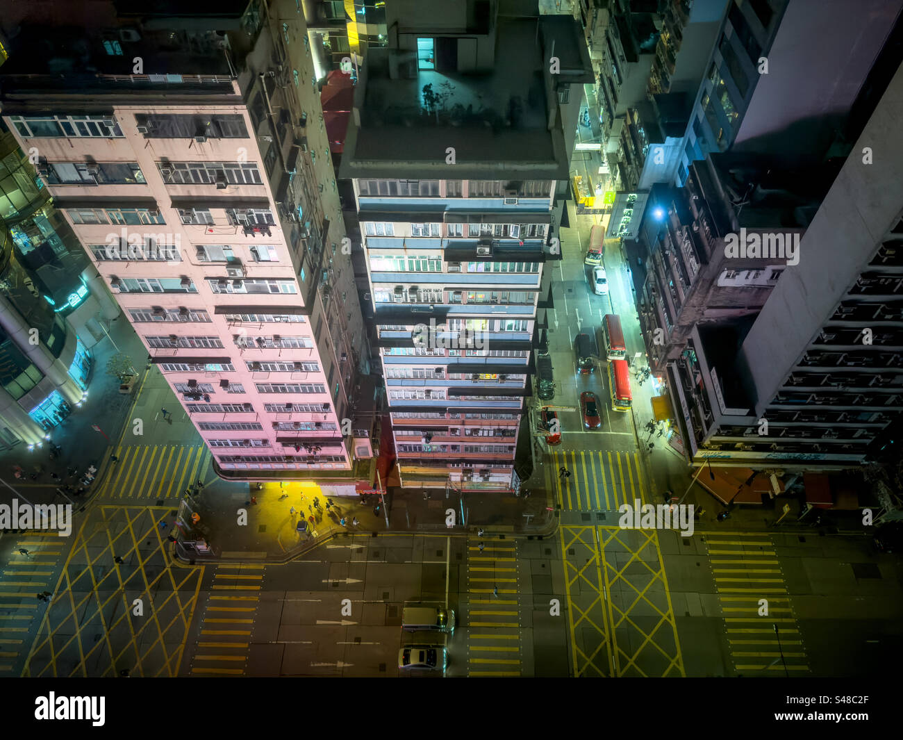 Aerial view over the streets of the Mong Kok district of Hong Kong at night - Smartphone Captured Stock Image