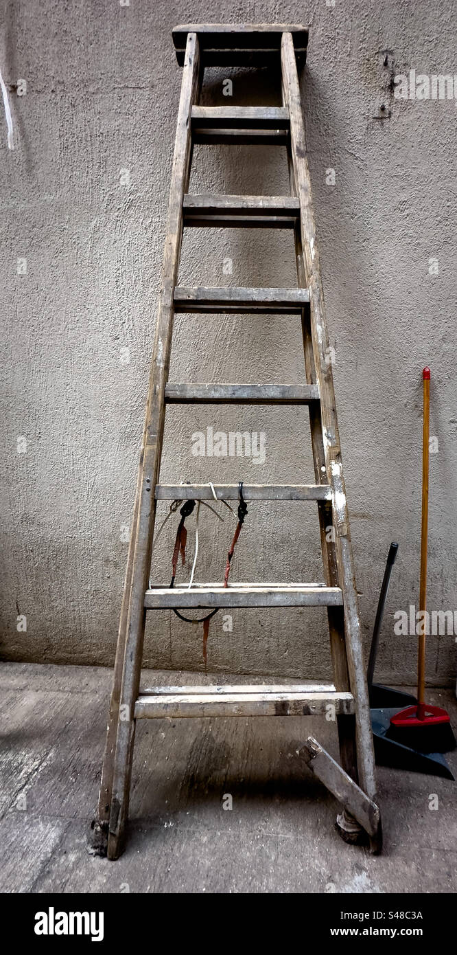 Ladder Clean Old wooden ladder with cleaning supply Stock Photo - Alamy