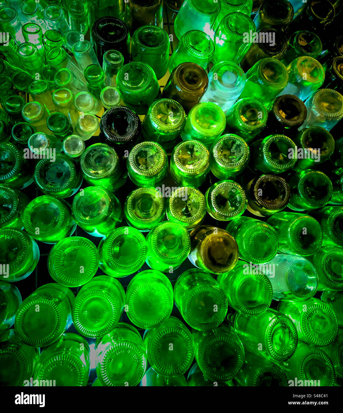 Array of green glass bottles, reused and repurposed for decoration - Smartphone Captured Stock Image