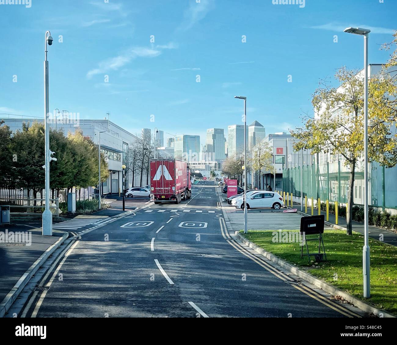 Lorry delivering goods, Canary Wharf from Bidder Street, Canning Town, London Stock Photo