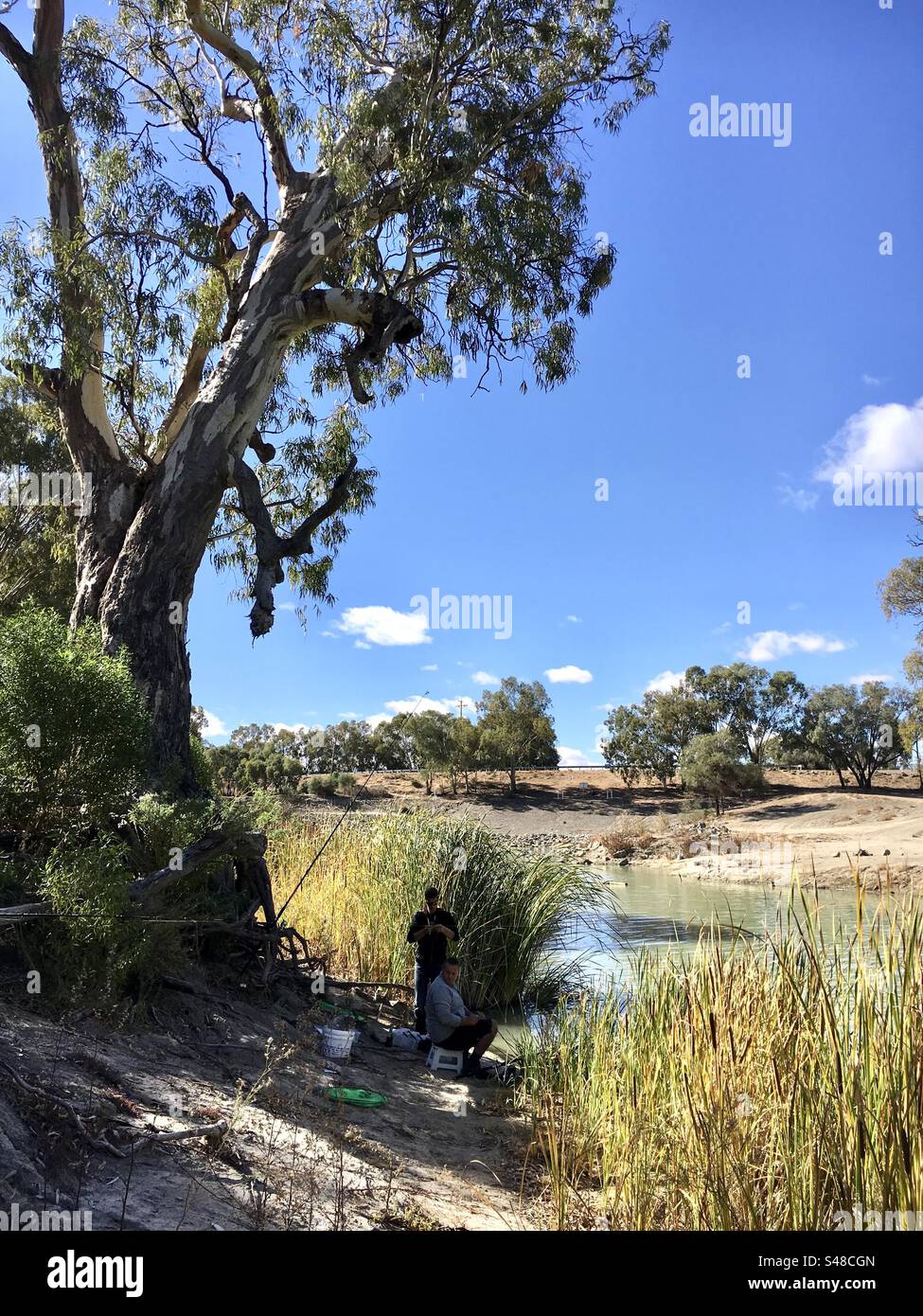 Group of friends fishing - Outback NSW Australia Stock Photo