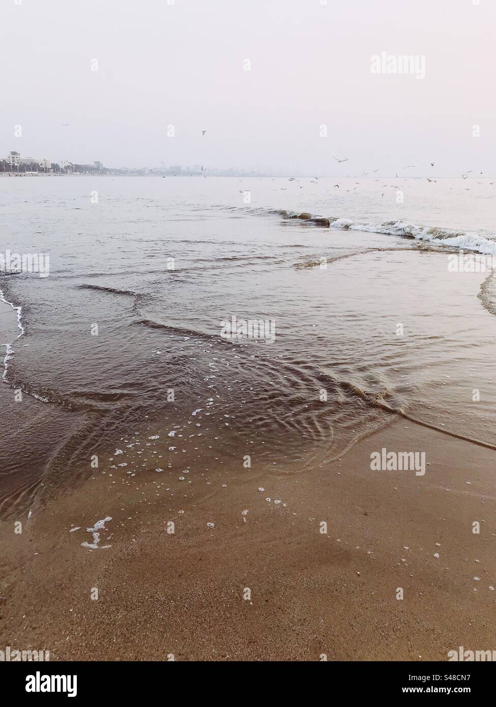 Ocean tide patterns on Versova beach in Mumbai, India - Smartphone Captured Stock Image
