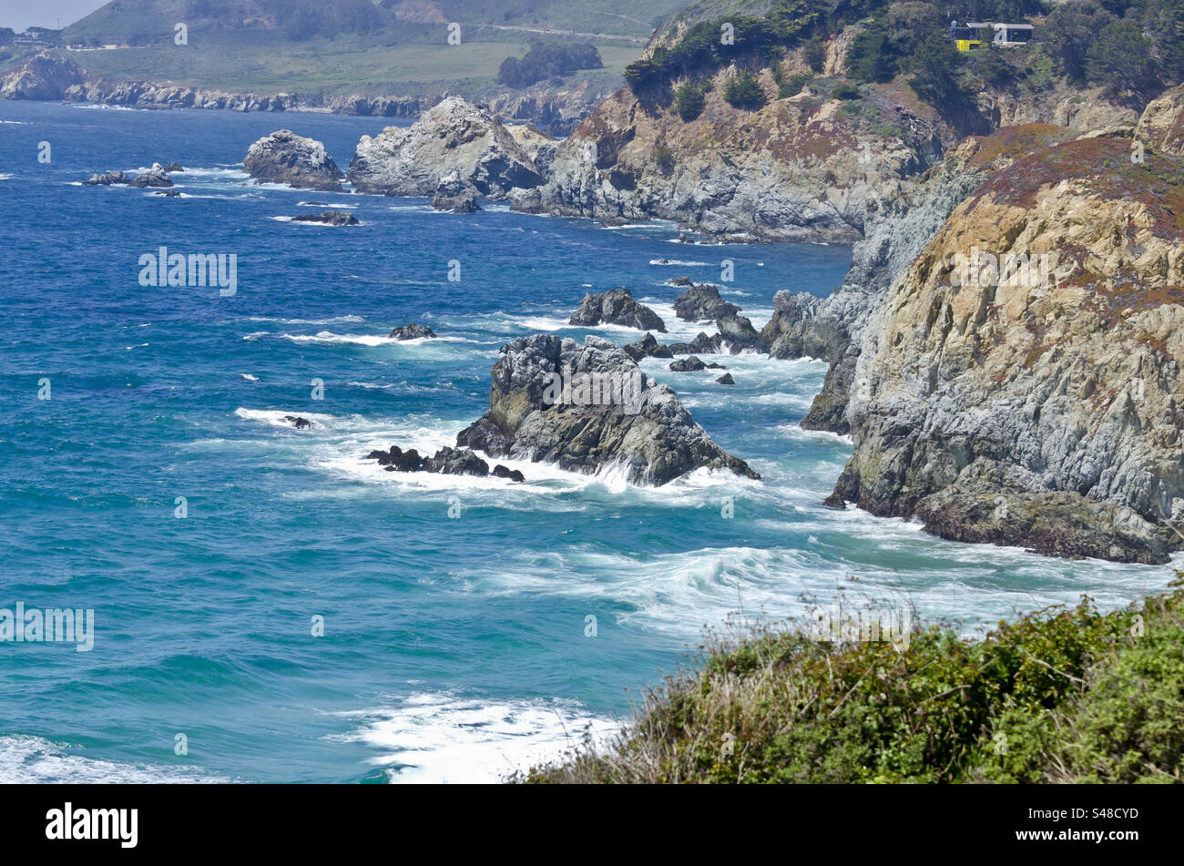 Waves crashing along the California coast line Stock Photo