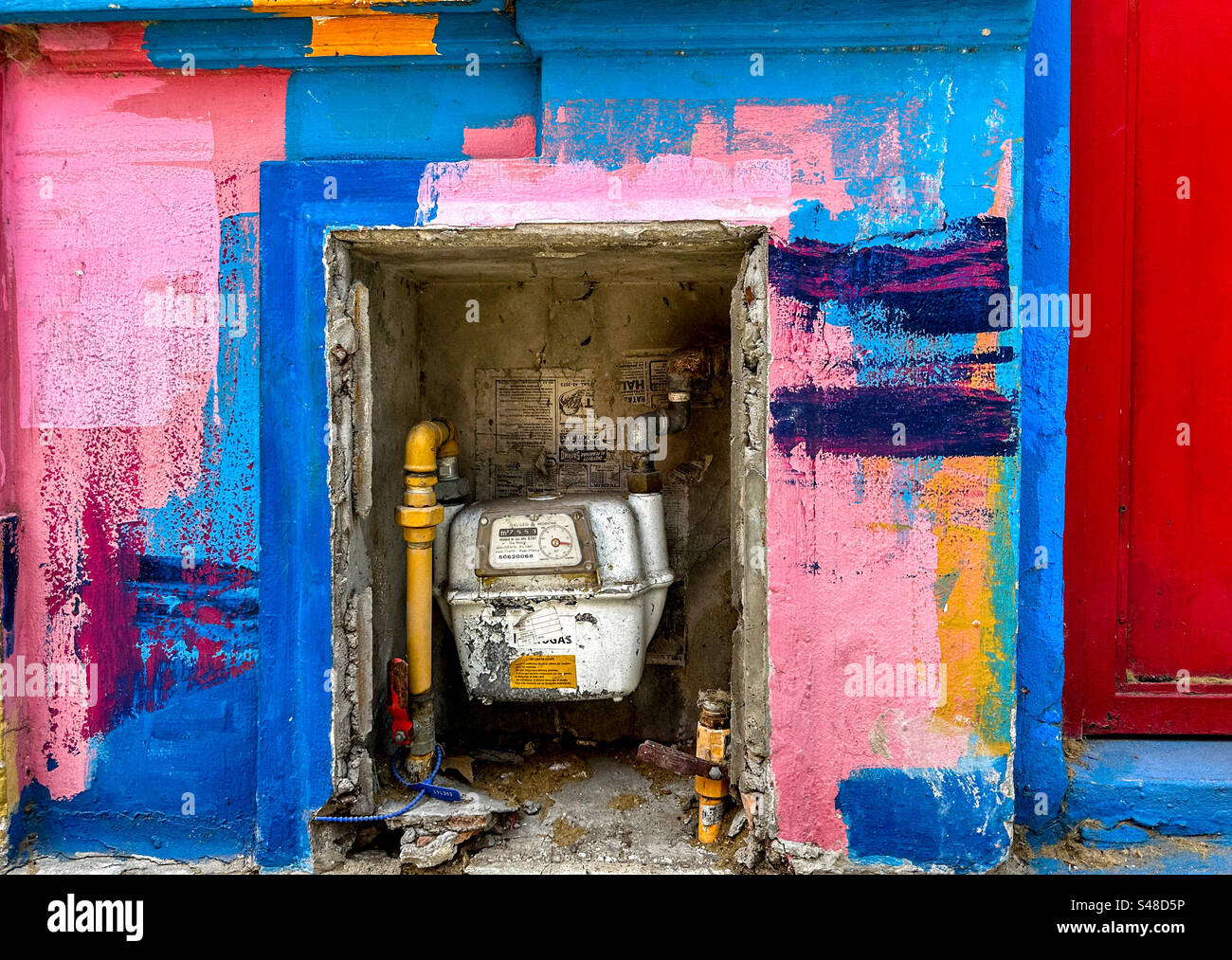 Colorful paint decorating even the mundane utility meter in the neighborhood of Palermo Viejo, a popular area filled with chic stores and trendy restaurants in Buenos Aires, Argentina - Smartphone Captured Stock Image